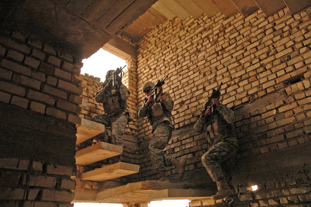 Soldiers play it safe as they head up the staircase