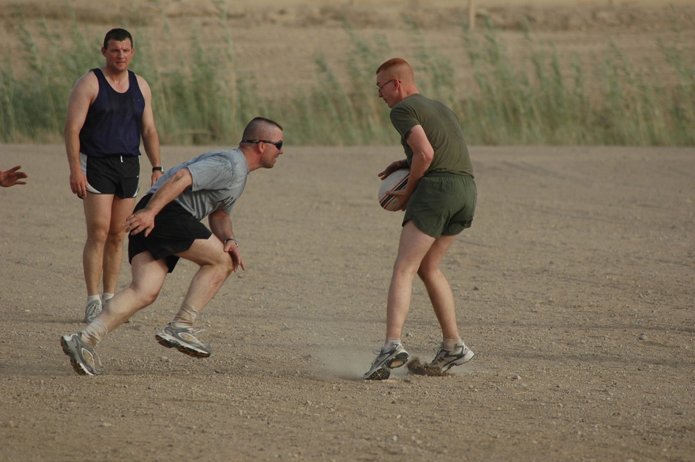 A player rushes to tackle his opponent