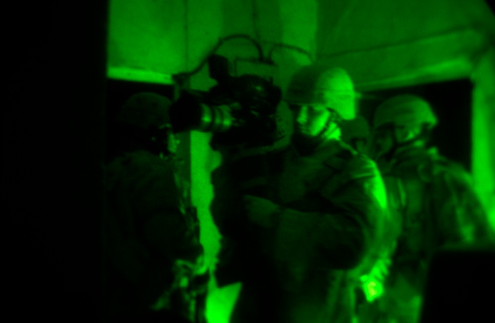 SrA, David Fitzroy is video taping the raid