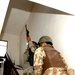 Iraqi Army soldiers searched houses in the town of Al Julaam