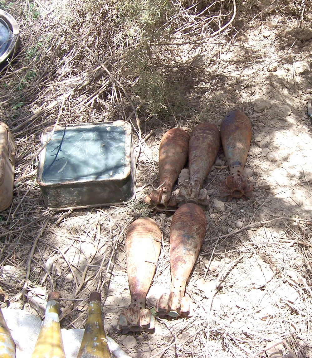 Soldiers find three weapons caches on an island