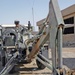 Sgt. Ray Eilerman digs a trench for fiber optic cable