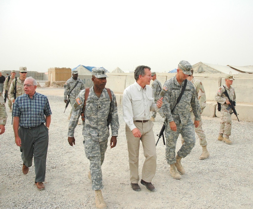 Jim Marshall talks with 1st Sgt. Barry Smallwood