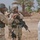Sgt. 1st Class Brian Faltinson talks with an Iraqi man