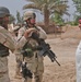 Sgt. 1st Class Brian Faltinson talks with an Iraqi man