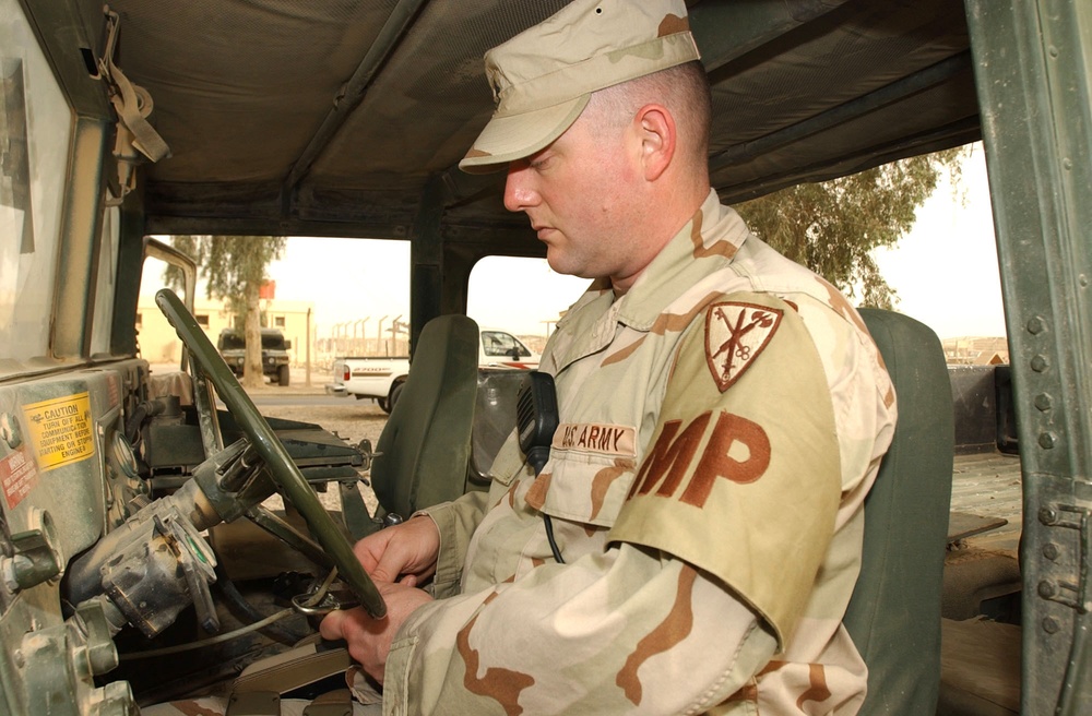 SFC Buckner demonstrates the proper way to secure a humvee.