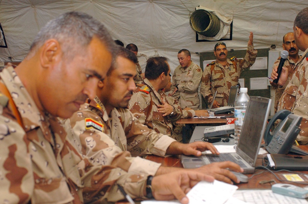 Officers in the 6th Iraqi Army monitor simulated troop movement