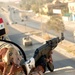 An Iraqi Soldier displays his country's flag with pride by wearing i