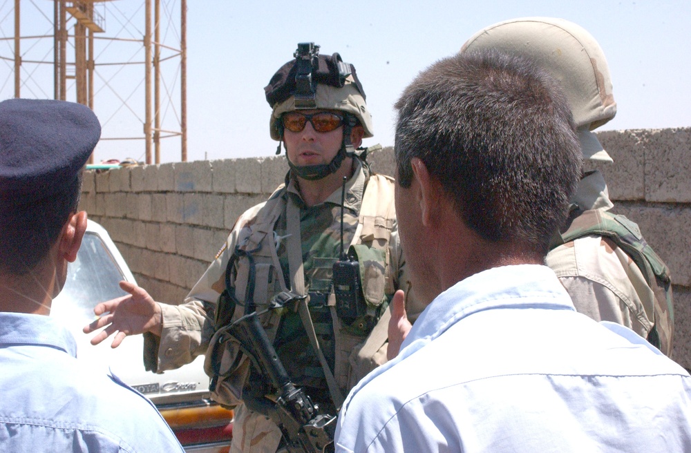 Staff Sgt. John Lamott has a detailed mission briefing with memb