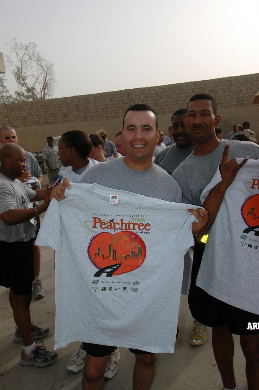 1LT Venton and Sgt Kelly show off their prized Peachtree Road Race t-shirts