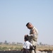 366th Mobile Public Affairs Detachment - visits with an Iraqi boy