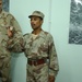 10.	An Iraqi Soldier shows off the award he was just presented with from Ma