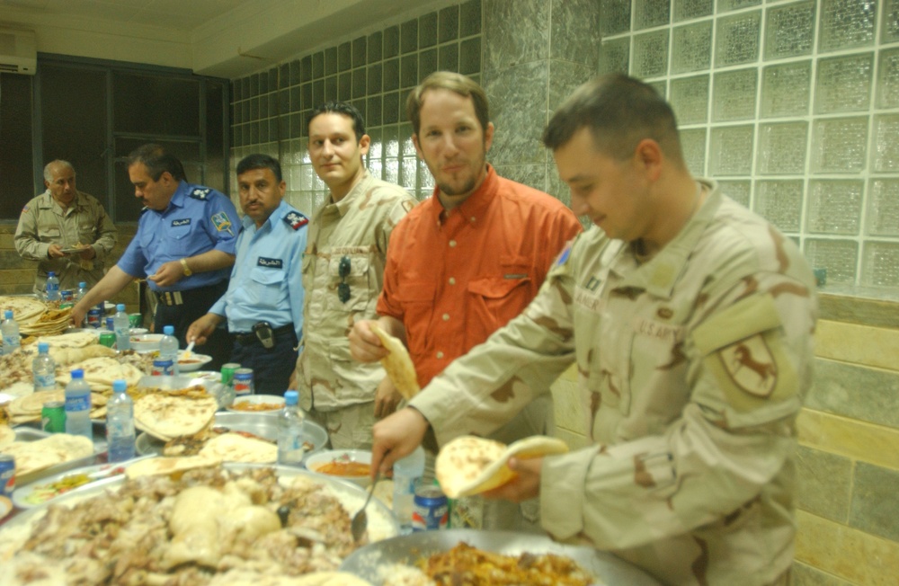 The Police Chief of Mosul, Maj. Gen. Rodriguez and other guests have lunch