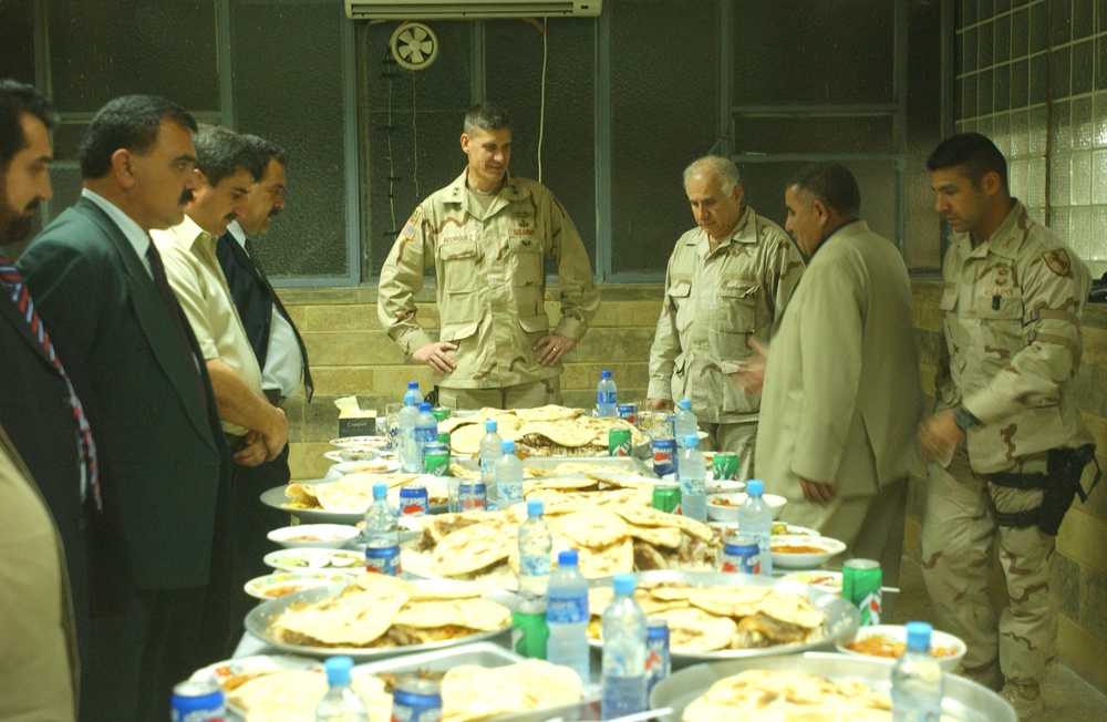 The Police Chief of Mosul, Maj. Gen. Rodriguez and other guests have lunch