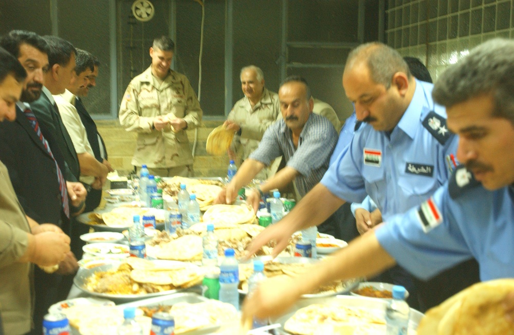 The Police Chief of Mosul, Maj. Gen. Rodriguez and other guests have lunch