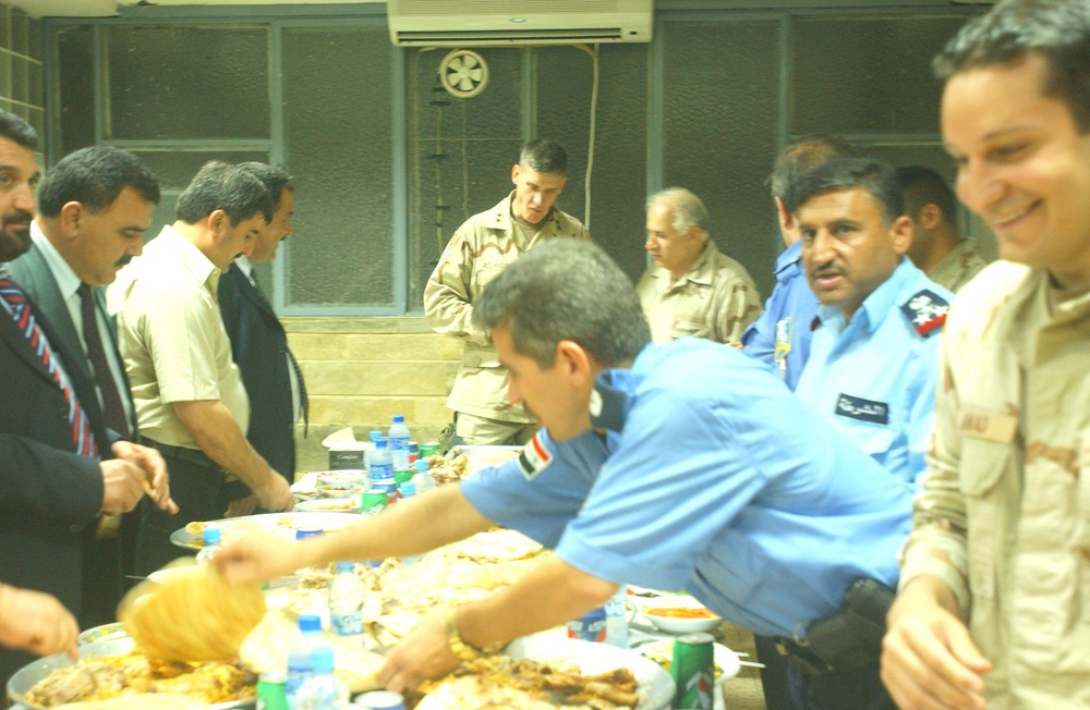 The Police Chief of Mosul, Maj. Gen. Rodriguez and other guests have lunch