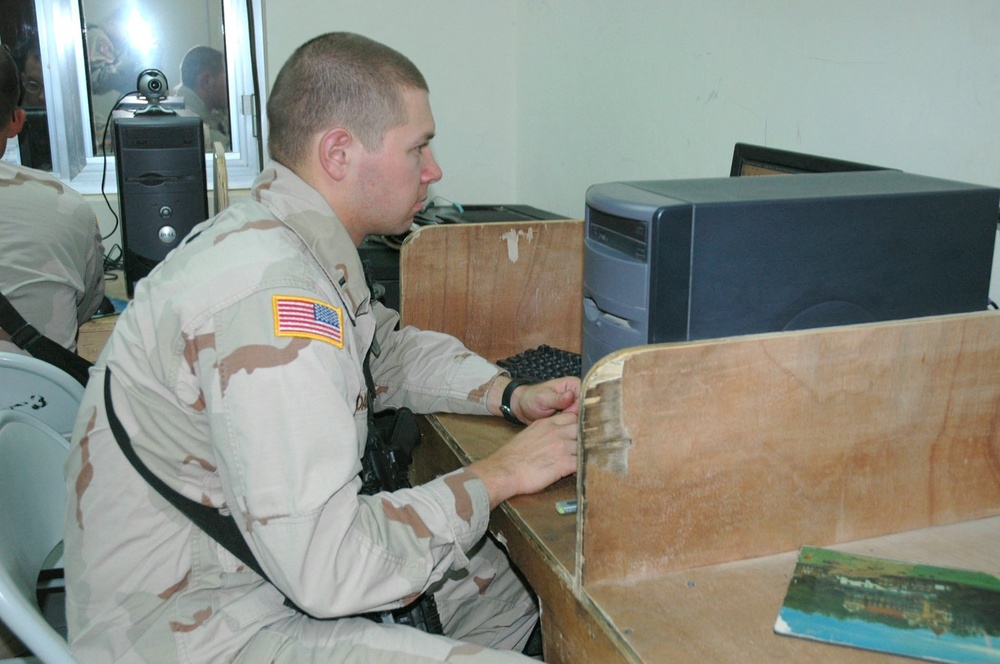 1LT Dane uses a computer at the MWR Center