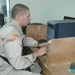 1LT Dane uses a computer at the MWR Center