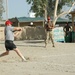 A Soldier with team Alamo Warriors swings at the ball