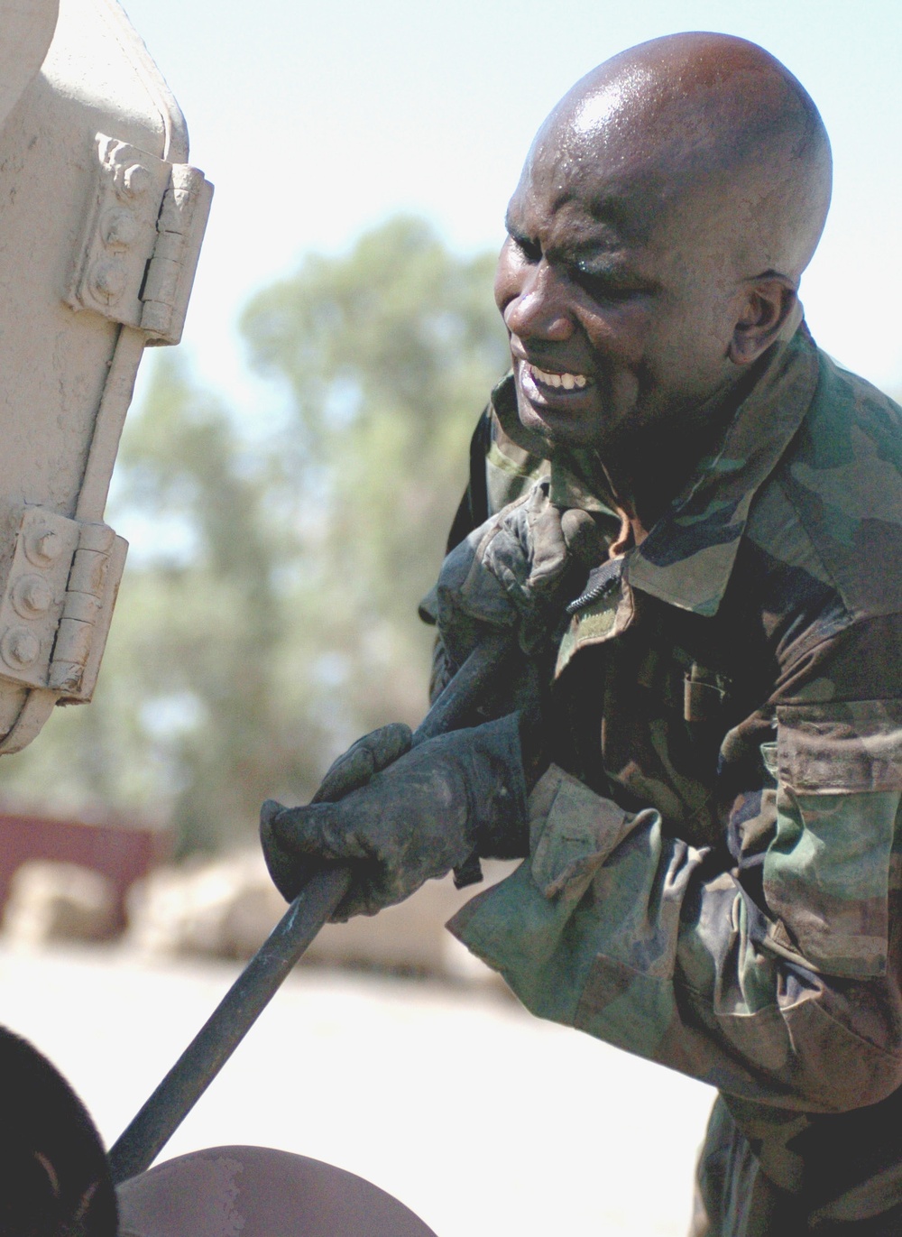 Sgt Jones replaces a track on his Bradley Fighting Vehicle 2