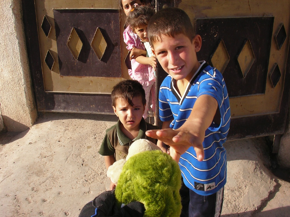 An Iraqi boy takes a Toy
