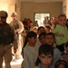 Soldiers Assisting Iraqi families during a medical screening