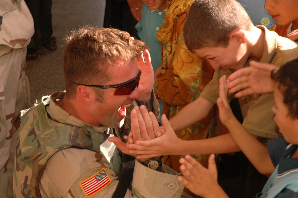 U.S. Soldier Plays with Children