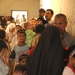 Iraqi families line up at a schoolhouse