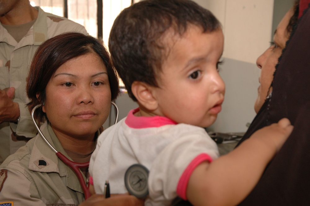 Spc. Donna E. Antonson Conducts Medical Exam