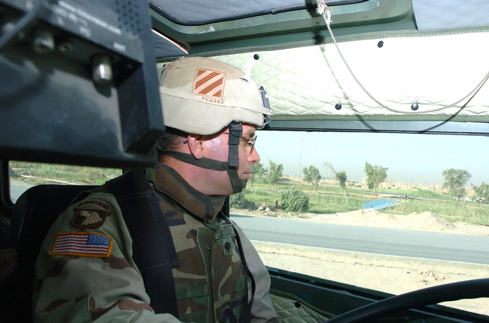 SPC Cotten scans roadside for bombs