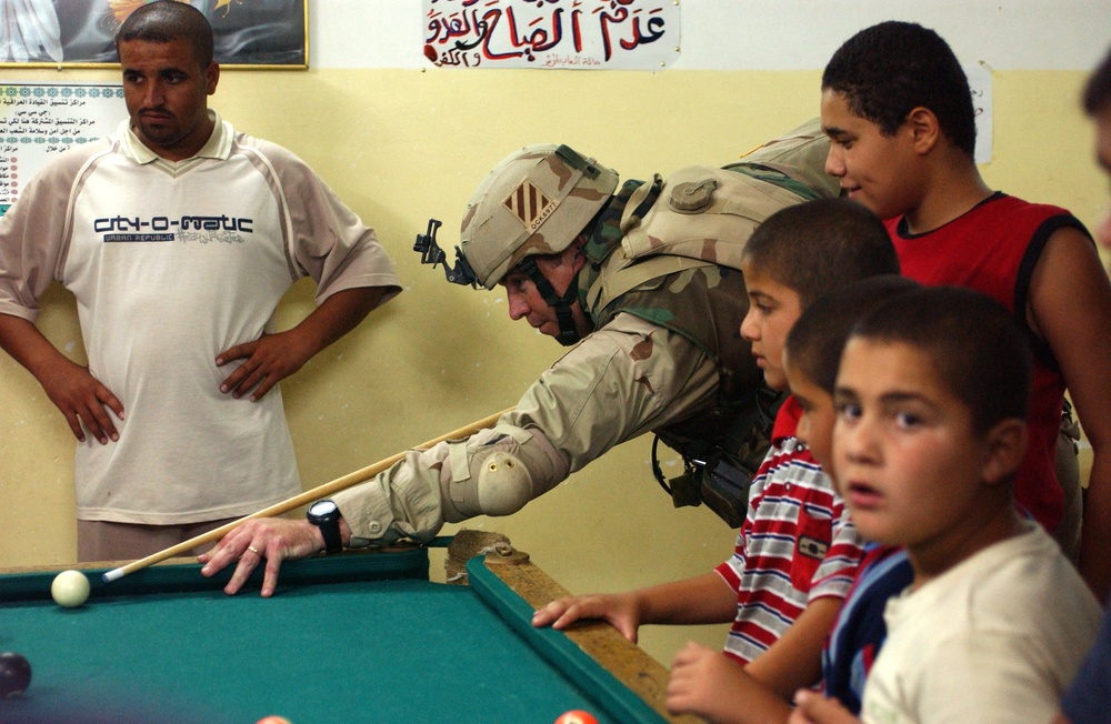 Maj. Michael Kelly challenges some Iraqi youth to a friendly gam