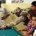 Maj. Michael Kelly challenges some Iraqi youth to a friendly gam