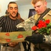 Spc. Richardson listens as Simon translates a card made for the Soldiers by