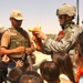 Capt. Christopher Ortega shows off a stuff animal