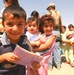 Young Iraqi boy smiles for camera