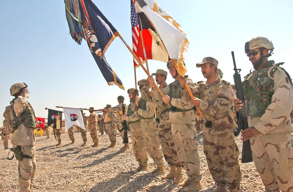 Salutes are rendered by coalition Soldiers to the United States Colors