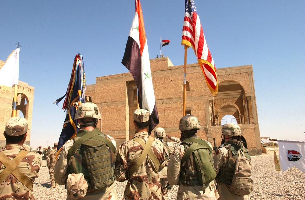 The Iraqi Colors being raised over Forward Operating Base Omaha