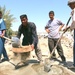 Iraqis work to build a school in the Diyala Providence