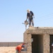 Iraqis work to build a school in the Diyala Providence