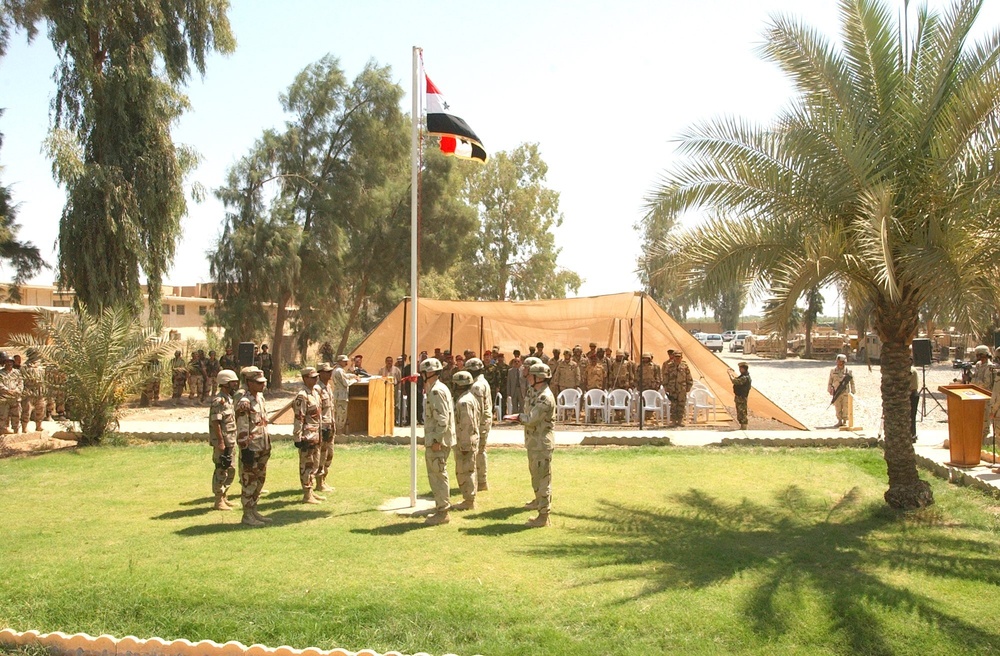 The Iraqi Colors are raised over the former Forward Operating Base Scunion