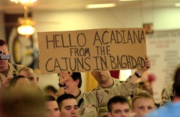 LA Soldiers from the 256th BCT hold up a sign for the Today Show came