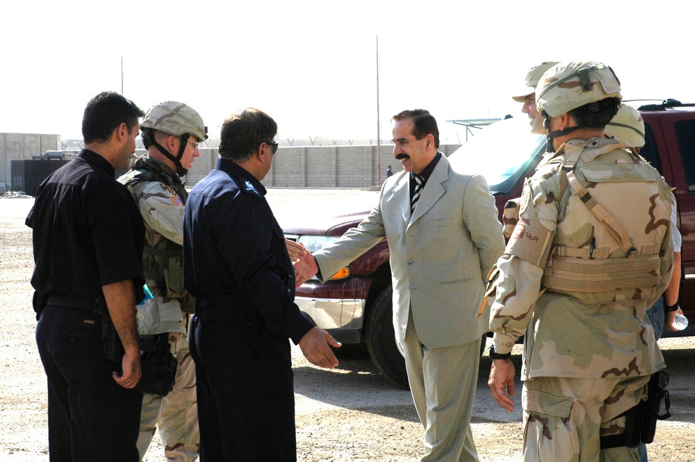 Maj. Johnson, greets the Deputy Minister of Interior for Iraqi Police, Maj.