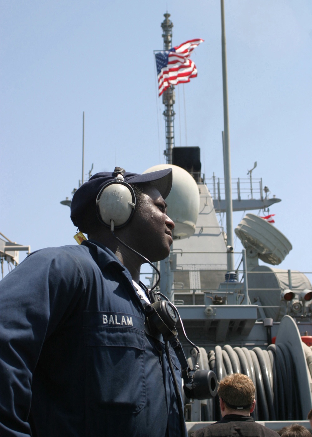 Seaman Balam stands watch aboard the USS Dextrous