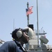 Seaman Balam stands watch aboard the USS Dextrous