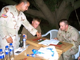PFC Tschiderer and SPC Brois explain sniper attack to LT Stone of the CCCI