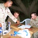 PFC Tschiderer and SPC Brois explain sniper attack to LT Stone of the CCCI