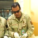 SGT Castro checks a prisoners belongings