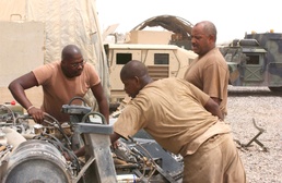 50th MST Soldiers trouble shoot a Humvee engine