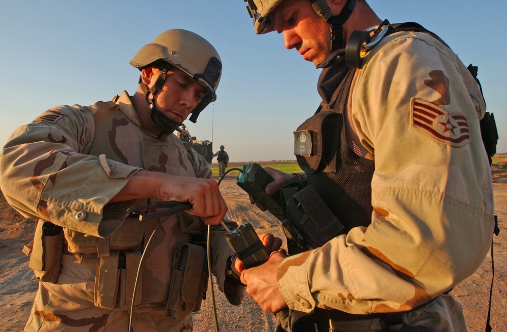 SSG Wills and SR Airman Brown prepare a charge of C-4 explosives