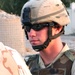SPC Douglas on Guard Duty talking to an Army Reporter